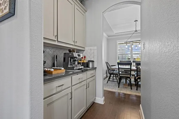 a kitchen with stainless steel appliances granite countertop cabinets and wooden floor