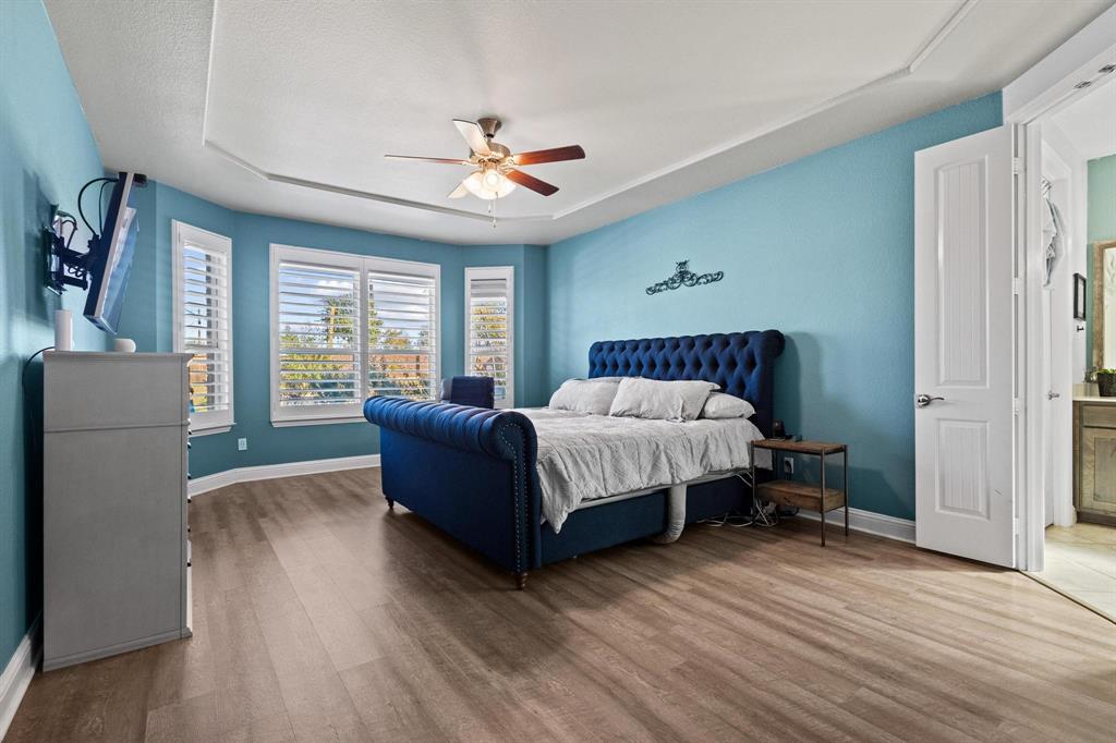 13798 Fernando Road Frisco, TX 75035 - Photo 17 of 39 a spacious bedroom with a bed and a large window
