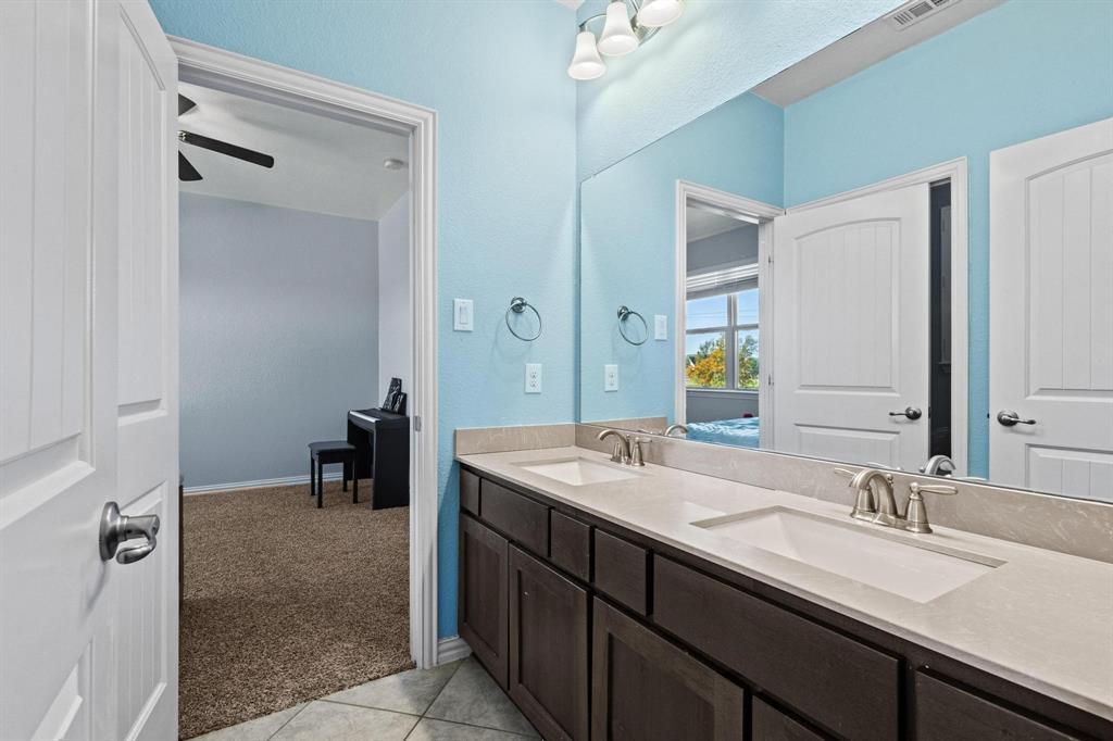 13798 Fernando Road Frisco, TX 75035 - Photo 30 of 39 a bathroom with a sink double vanity and a mirror