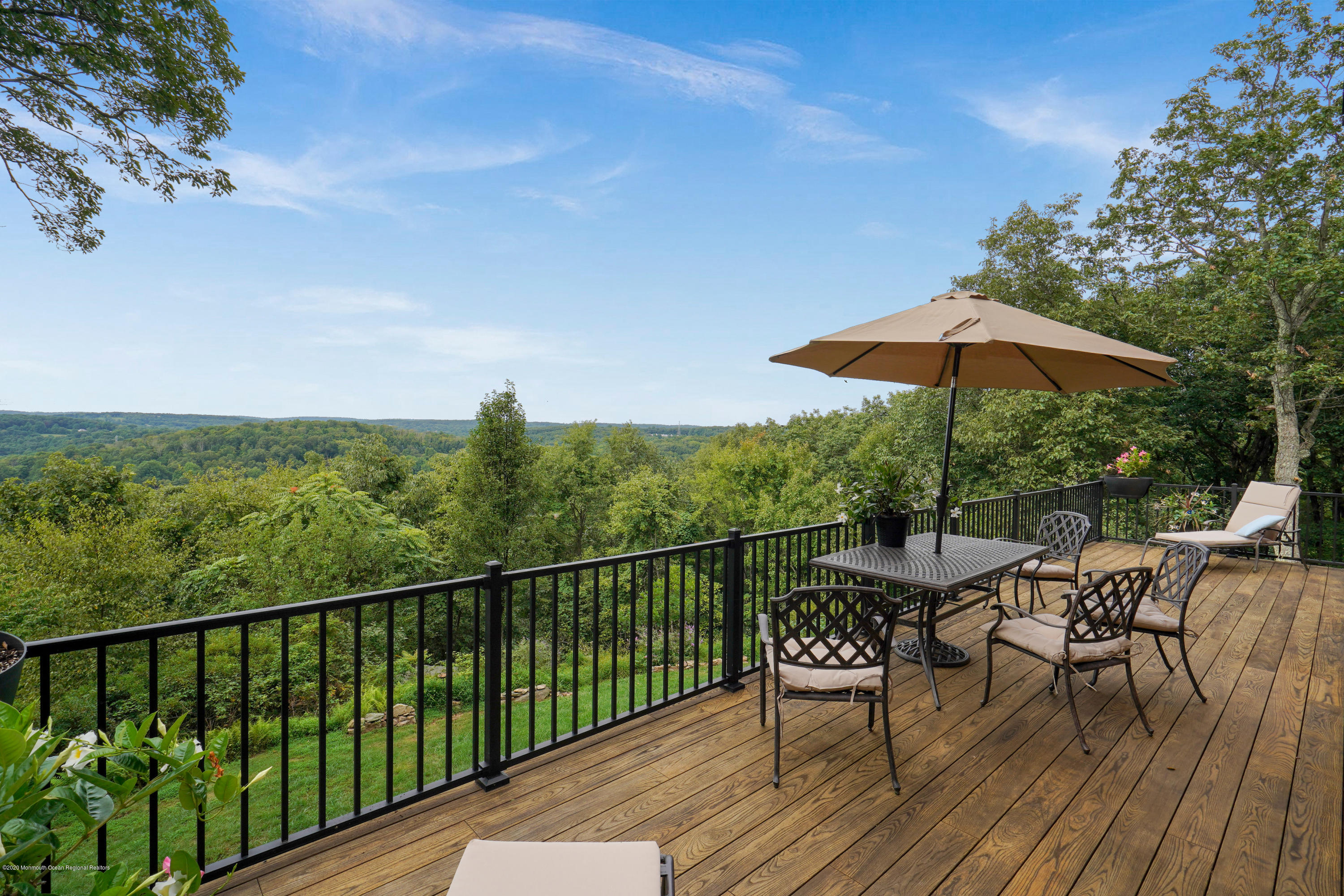 37 Ridge Road Lebanon, NJ 08833 - Photo 11 of 82 a view of a balcony with furniture and wooden floor