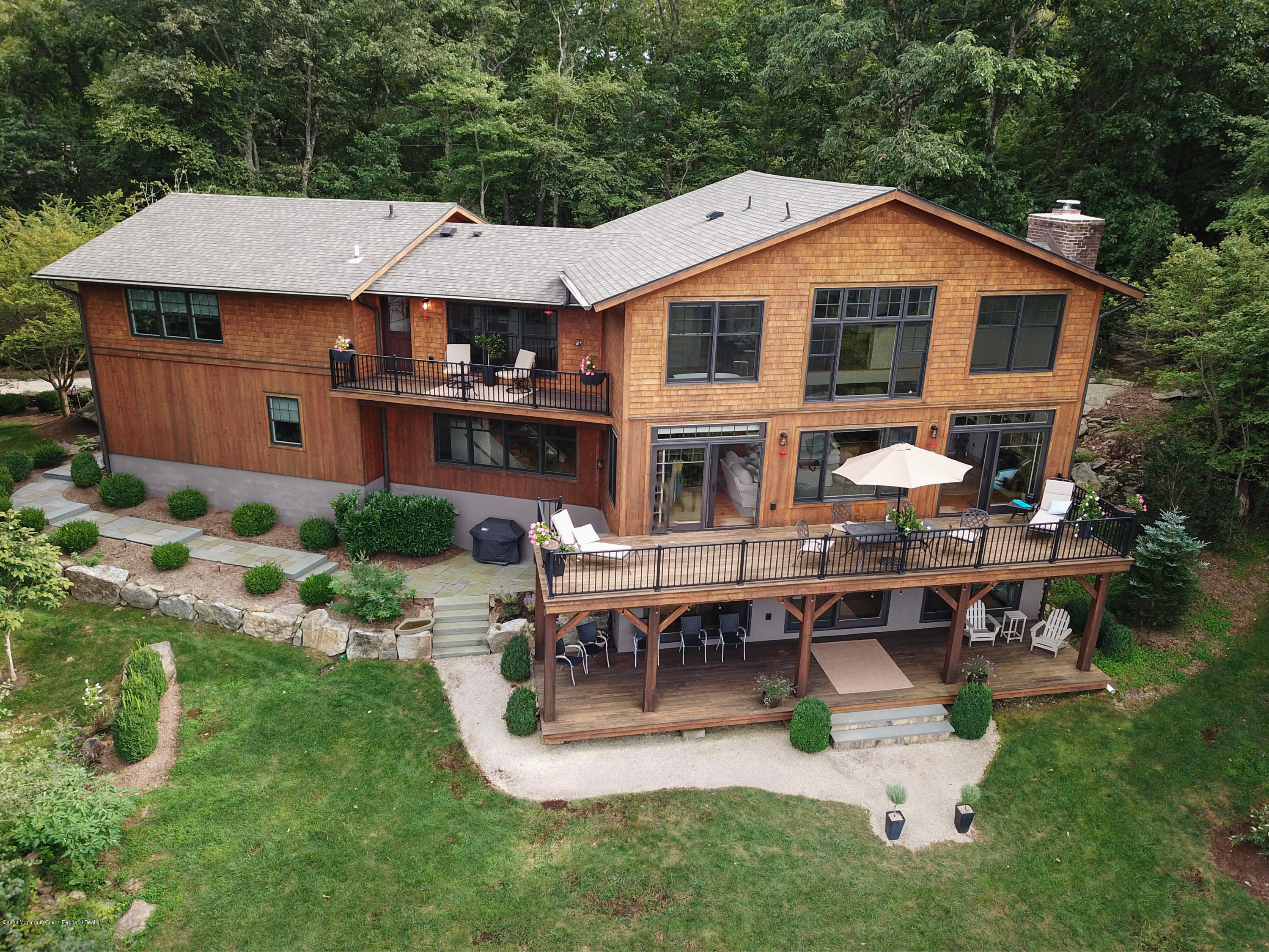 37 Ridge Road Lebanon, NJ 08833 - Photo 4 of 82 a aerial view of a house with table and chairs under an umbrella