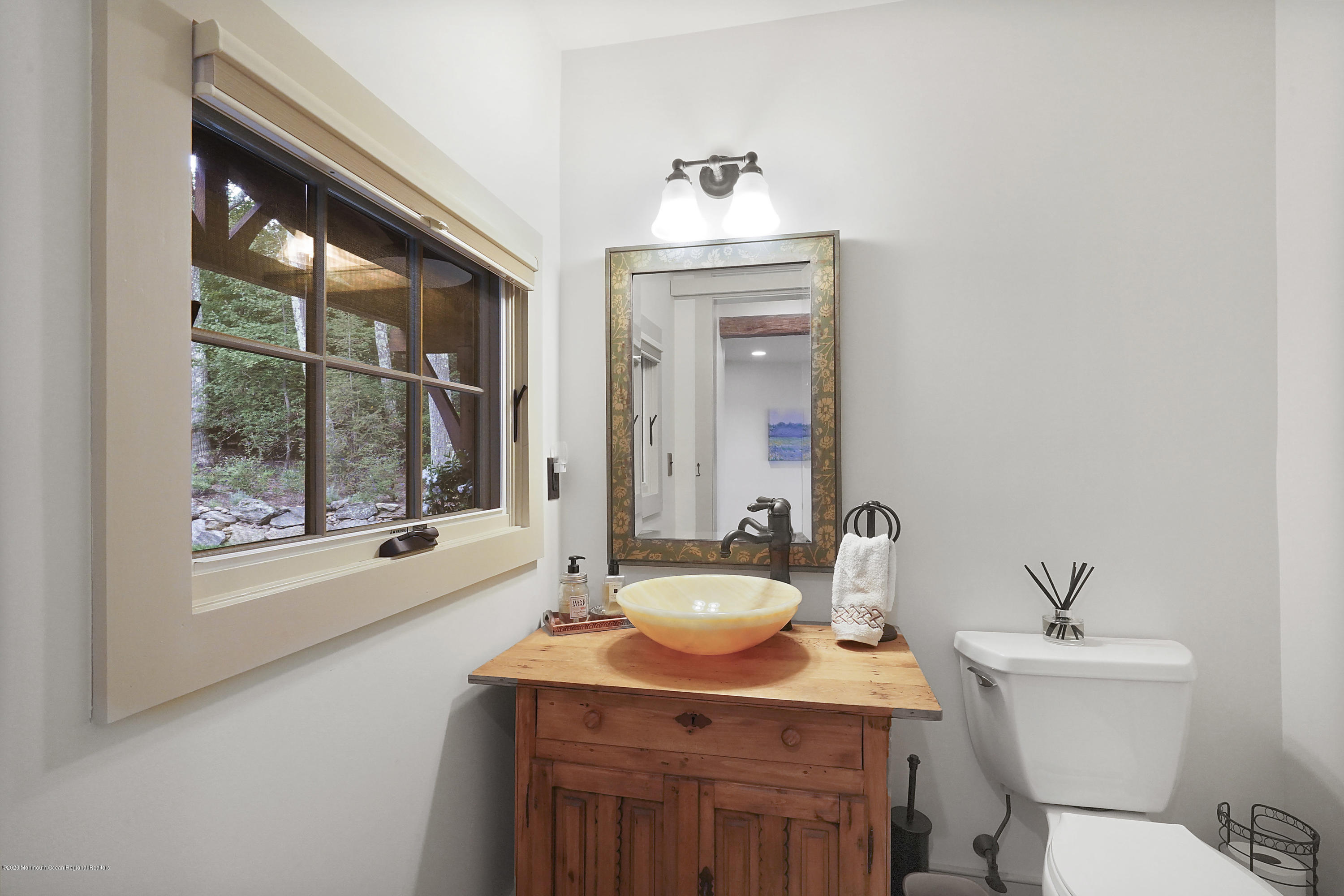 37 Ridge Road Lebanon, NJ 08833 - Photo 48 of 82 a bathroom with a sink mirror toilet and next to a window