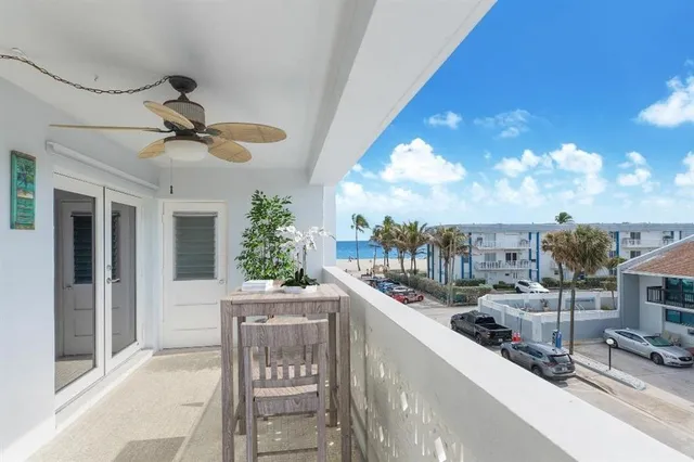 a kitchen with a sink and chandelier