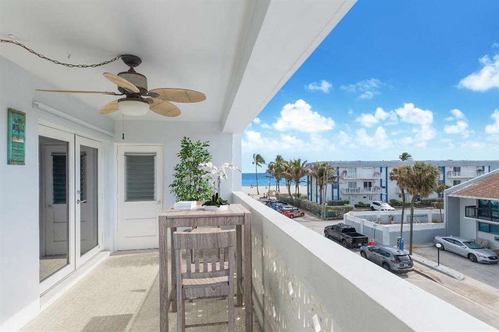 320 South Surf Road, Unit 304 Hollywood, FL 33019 - Photo 11 of 20 a kitchen with a sink and chandelier
