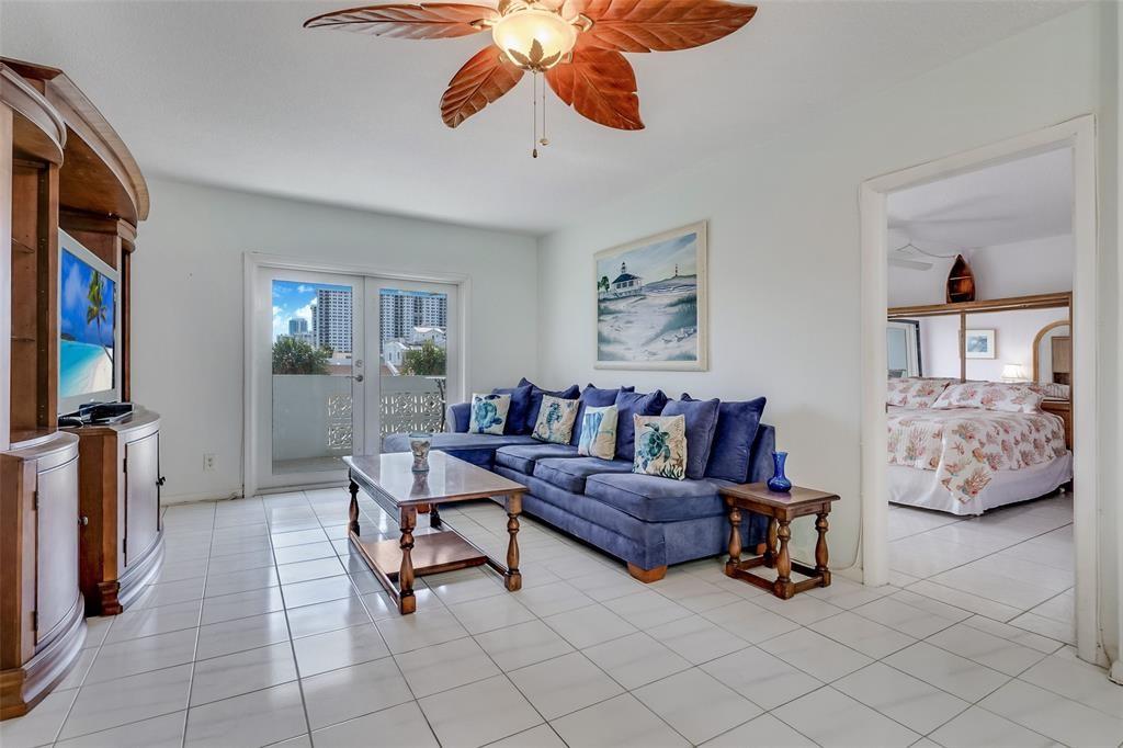 320 South Surf Road, Unit 304 Hollywood, FL 33019 - Photo 13 of 20 a living room with furniture and a flat screen tv
