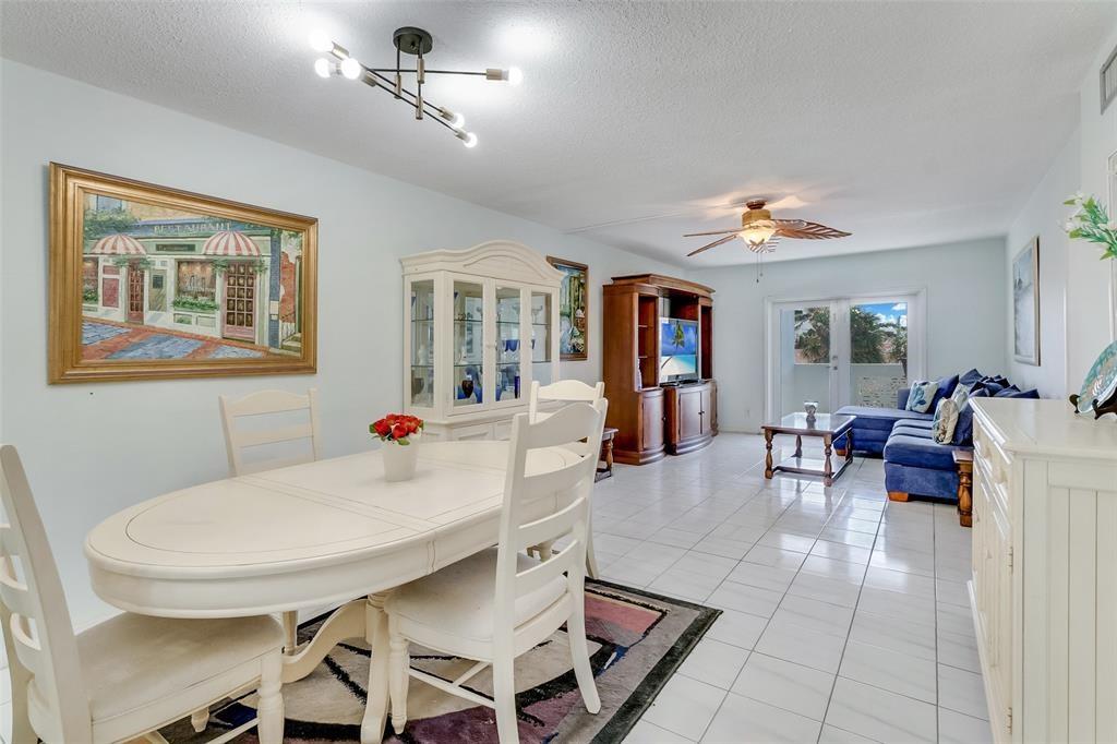 320 South Surf Road, Unit 304 Hollywood, FL 33019 - Photo 14 of 20 a living room with furniture and a dining table