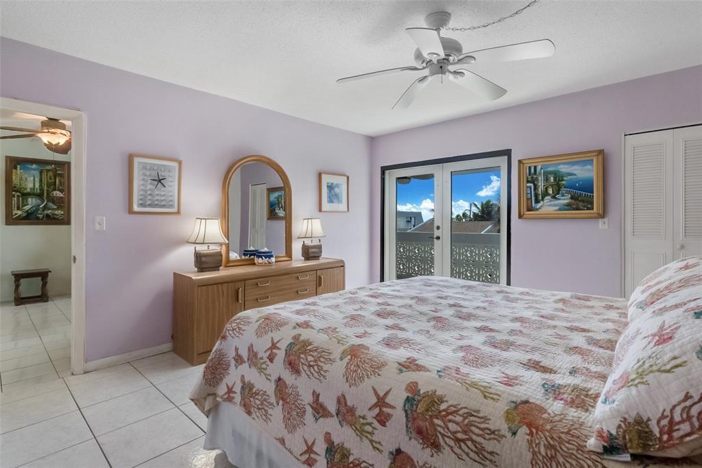 320 South Surf Road, Unit 304 Hollywood, FL 33019 - Photo 18 of 20 a bedroom with a bed and a dresser