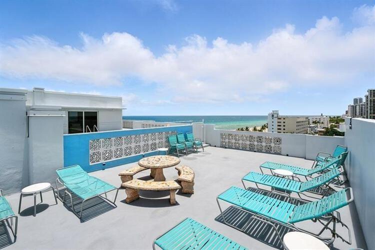 320 South Surf Road, Unit 304 Hollywood, FL 33019 - Photo 7 of 20 a view of a patio with couches chairs and a table and chairs