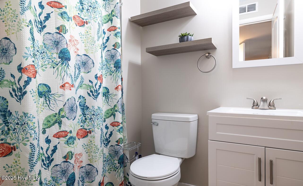 1505 Salter Path Road, Unit 325 Indian Beach, NC 28512 - Photo 15 of 46 Shared full bath at end of hallway