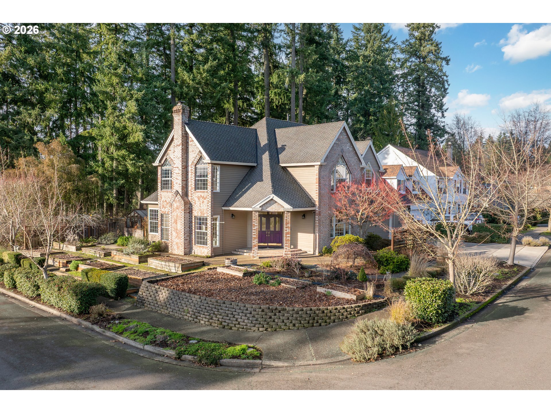 9985 Southwest 141st Avenue Beaverton, OR 97008 - Photo 1 of 47 a front view of a house with garden