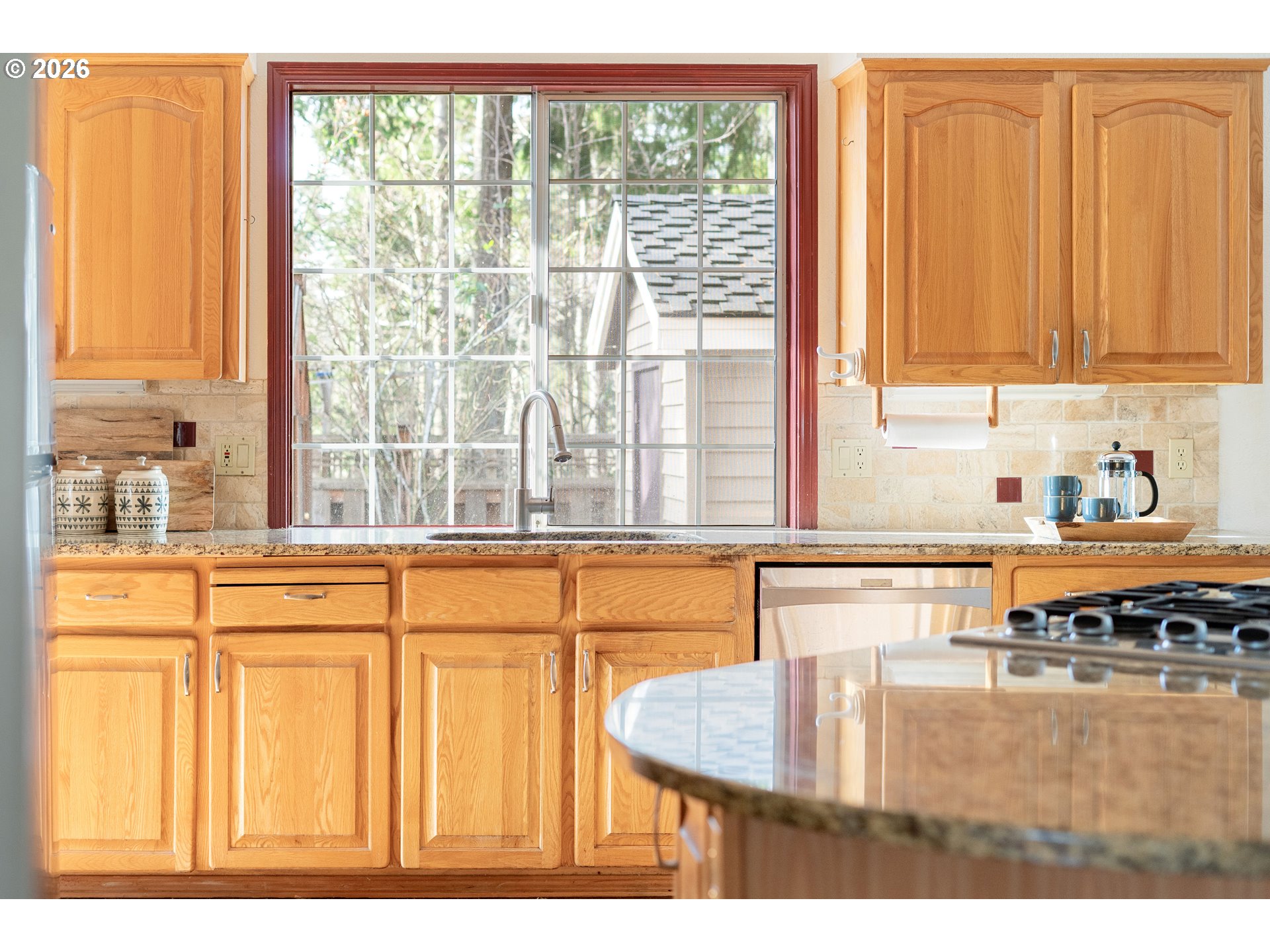 9985 Southwest 141st Avenue Beaverton, OR 97008 - Photo 14 of 47 a kitchen with stainless steel appliances granite countertop a sink and a window