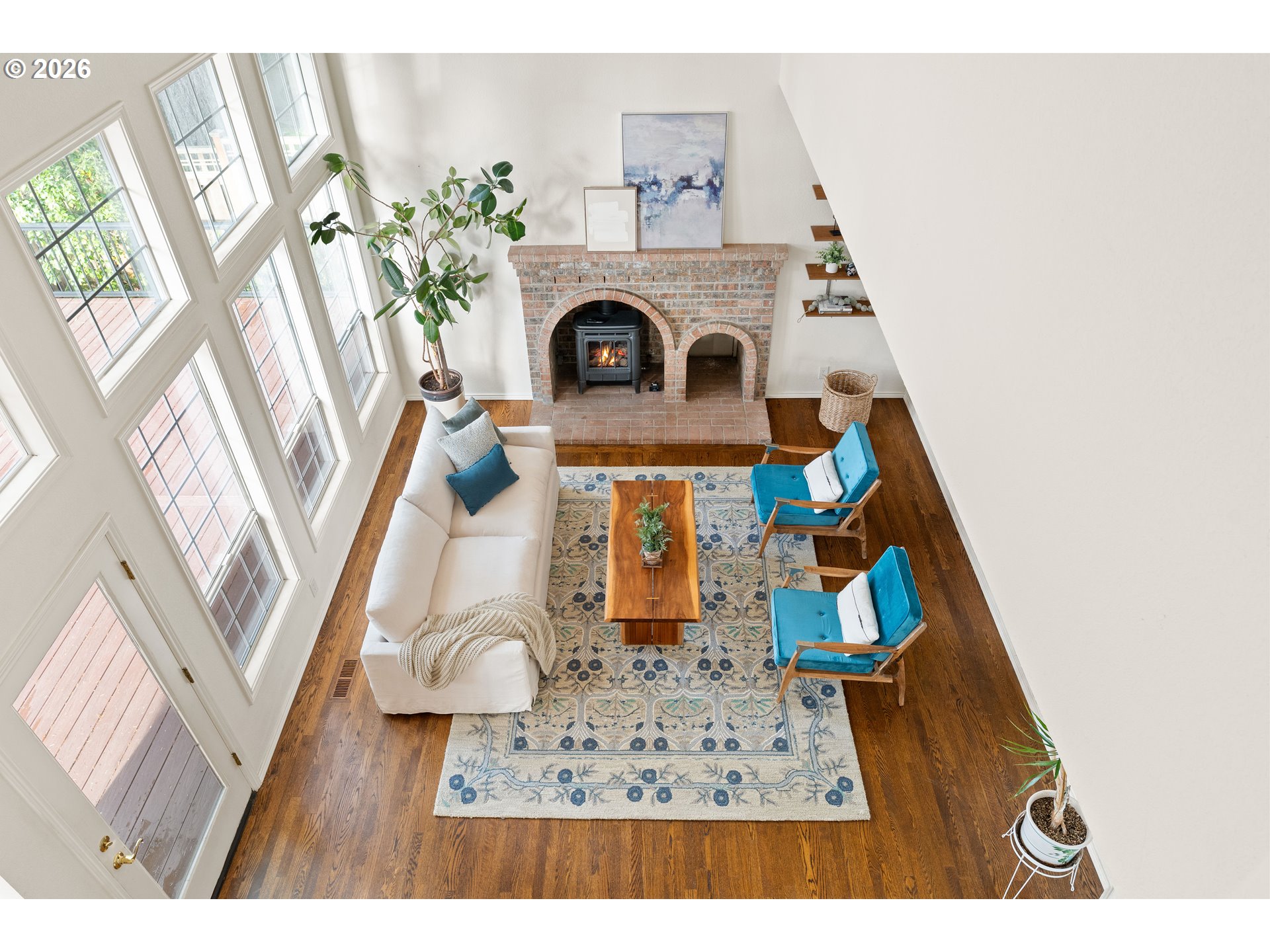 9985 Southwest 141st Avenue Beaverton, OR 97008 - Photo 26 of 47 a living room with furniture and a fireplace