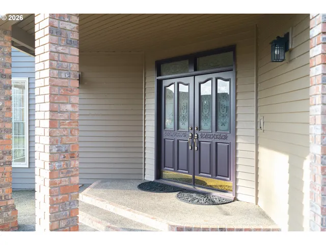a view of a hallway with a glass door