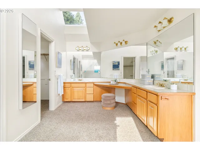 a en suite bathroom with a tub sink and view living room