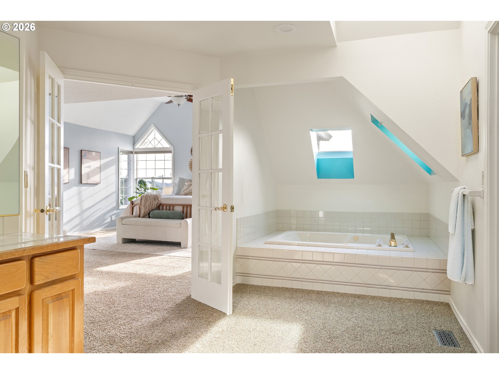 9985 Southwest 141st Avenue Beaverton, OR 97008 - Photo 33 of 47 a en suite bathroom with a tub sink and view living room