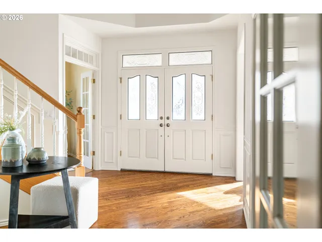 a view of an entryway with wooden floor