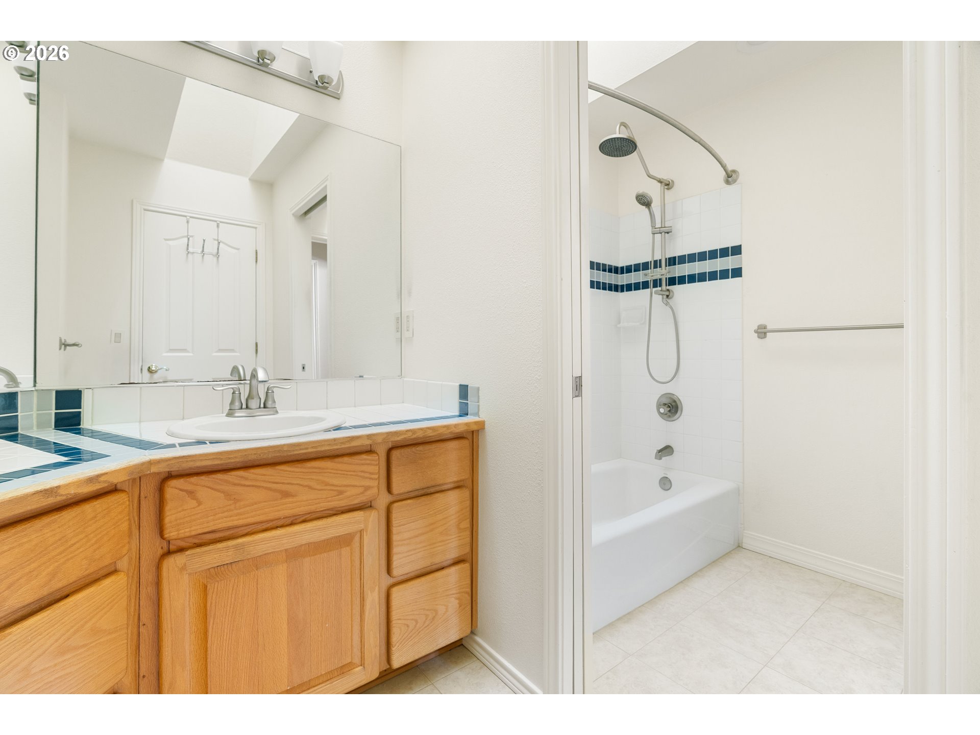 9985 Southwest 141st Avenue Beaverton, OR 97008 - Photo 41 of 47 a bathroom with a tub sink and mirror