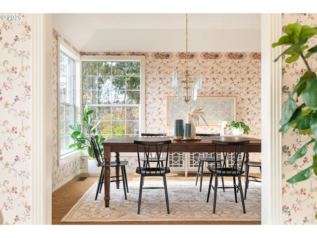 a dining room with furniture and wooden floor