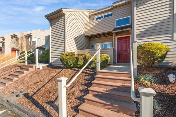 a view of a patio with table and chairs