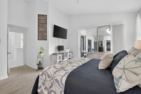 an aerial view of residential houses with outdoor space and street view