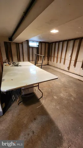 a bed sitting in a room next to a window