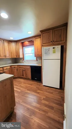 a view of kitchen and wooden floor