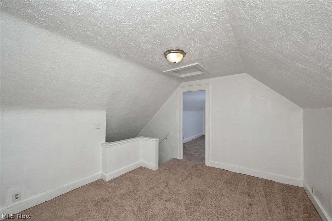 77 West Mildred Avenue Akron, OH 44310 - Photo 34 of 40 Additional living space with a textured ceiling and carpet flooring