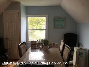 a view of living room with furniture and a window