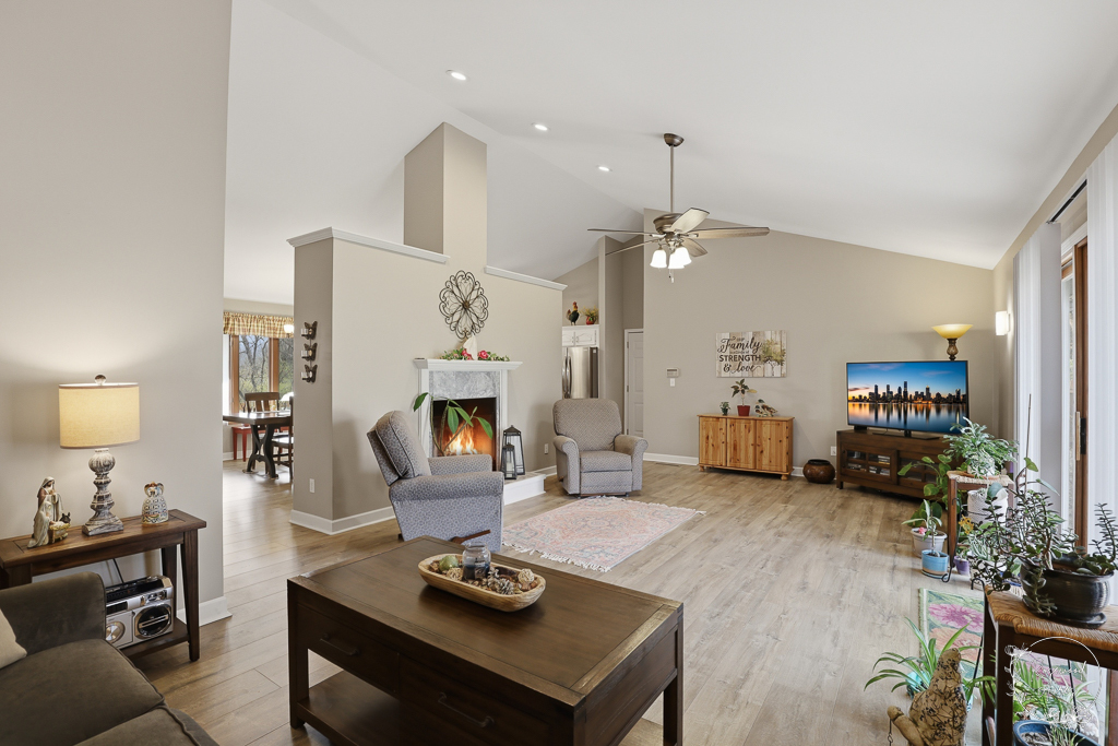 2853 Forsythia Lane St. Anne, IL 60964 - Photo 12 of 31 a living room with furniture and a fireplace