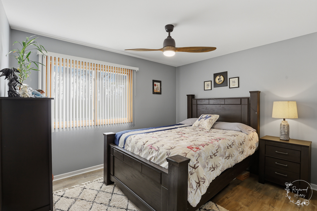 2853 Forsythia Lane St. Anne, IL 60964 - Photo 14 of 31 a bedroom with a bed and a chandelier