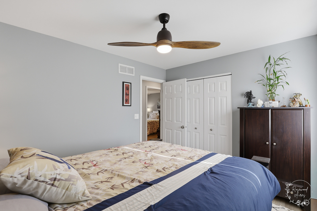 2853 Forsythia Lane St. Anne, IL 60964 - Photo 15 of 31 a bedroom with a bed and a chandelier