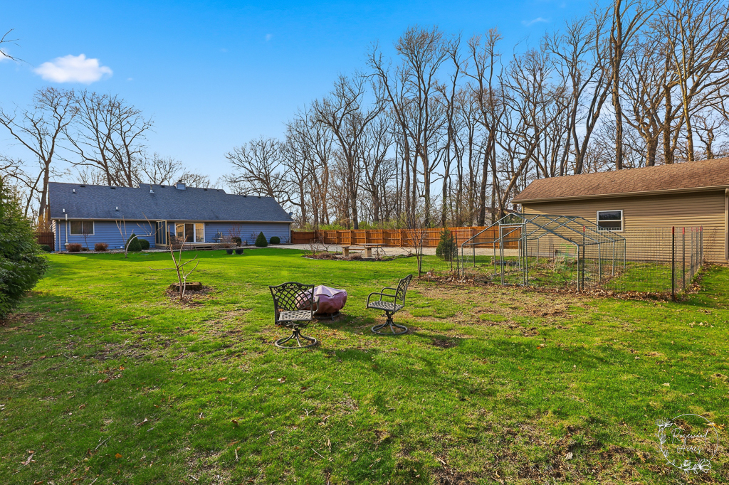 2853 Forsythia Lane St. Anne, IL 60964 - Photo 30 of 31 a view of a house with backyard and sitting area