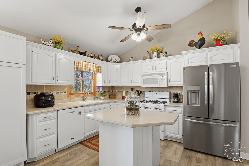 2853 Forsythia Lane St. Anne, IL 60964 - Photo 7 of 31 a kitchen with a sink stainless steel appliances and cabinets