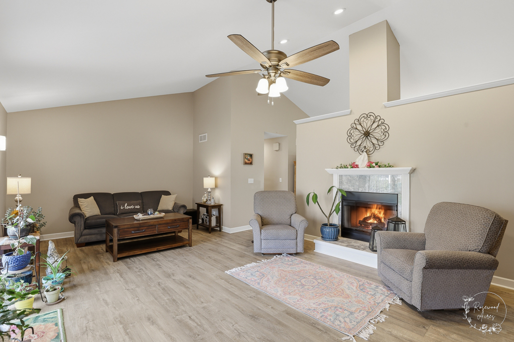 2853 Forsythia Lane St. Anne, IL 60964 - Photo 10 of 31 a living room with furniture and a fireplace