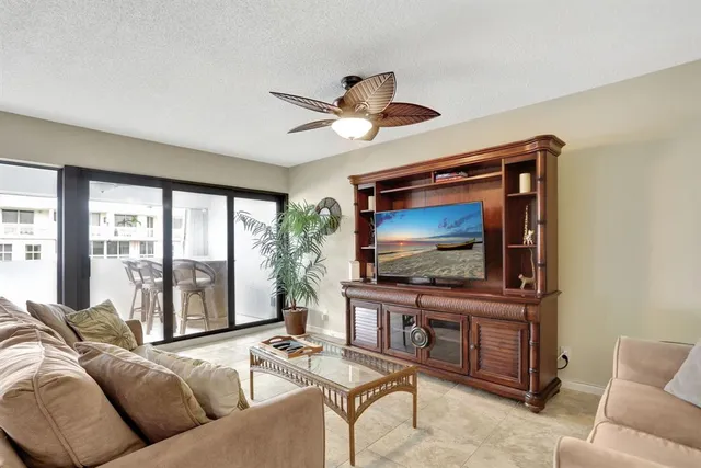 a view of swimming pool with outdoor seating and a garden