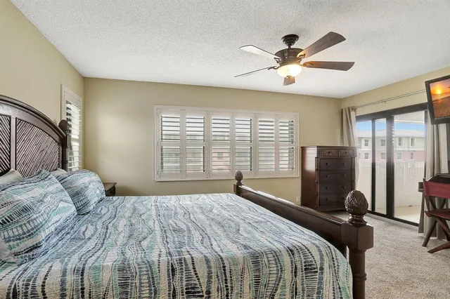 an outdoor dining space with furniture and mountain view