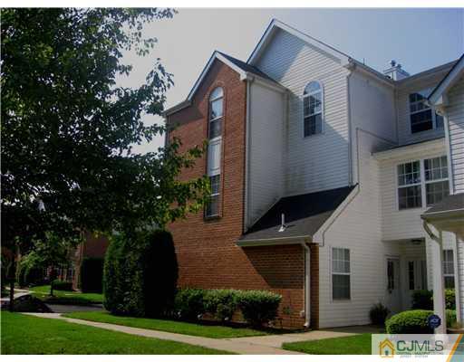 1409 Plymouth Road North Brunswick, NJ 08902 - Photo 1 of 10 a front view of a house with garden