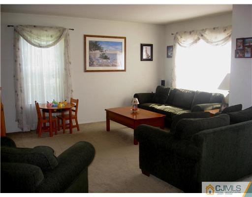1409 Plymouth Road North Brunswick, NJ 08902 - Photo 3 of 10 a living room with furniture and a window
