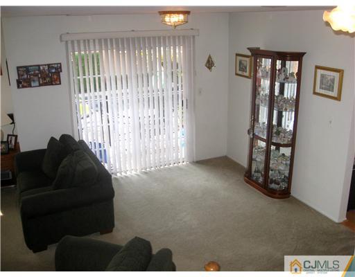 1409 Plymouth Road North Brunswick, NJ 08902 - Photo 4 of 10 a living room with furniture and a window