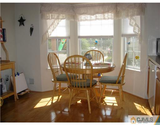 1409 Plymouth Road North Brunswick, NJ 08902 - Photo 5 of 10 a view of a dining room with furniture window and outside view