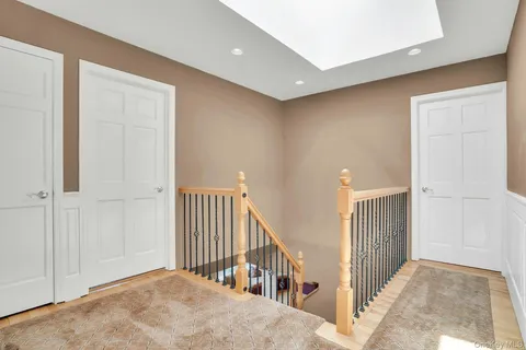 a view of a livingroom with a hall and entryway
