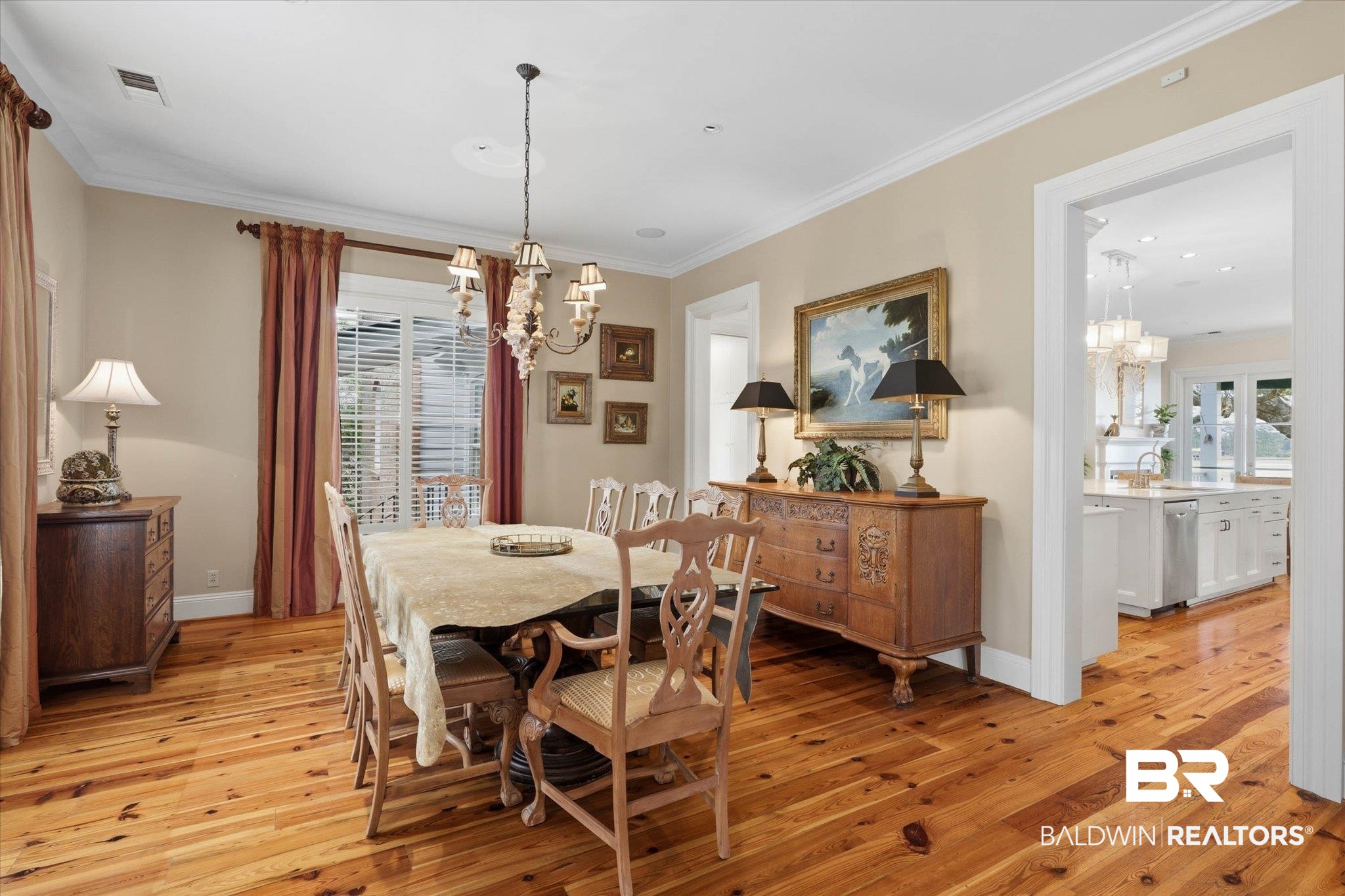3500 Higgins Road Mobile, AL 36619 - Photo 6 of 54 Dining area with suspended lighting, light wood finished floors, and crown molding
