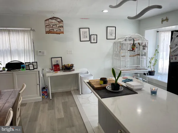 a kitchen with stainless steel appliances a sink a stove and a refrigerator