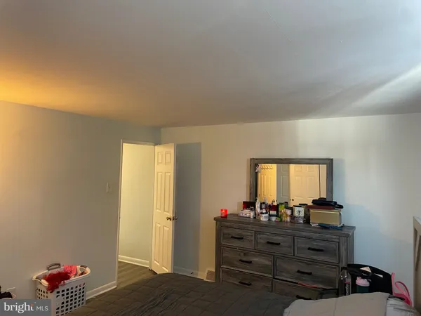 a room with furniture and a mirror