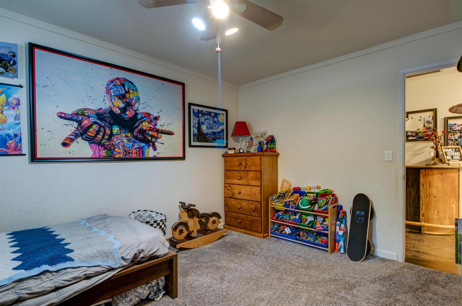 23832 Old Madrone Road Pioneer, CA 95666 - Photo 13 of 48 a bedroom with furniture and a painting on the wall