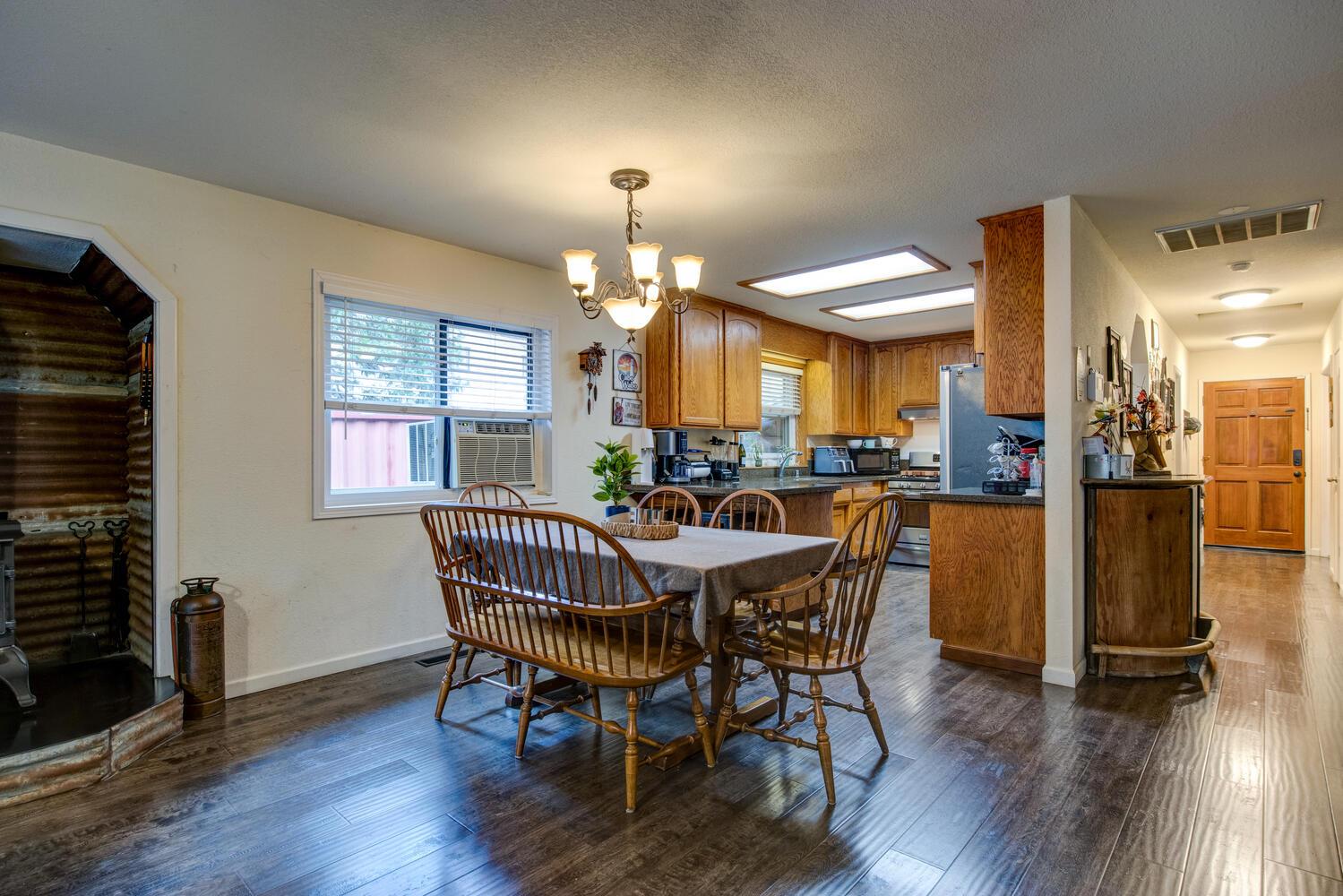 23832 Old Madrone Road Pioneer, CA 95666 - Photo 15 of 48 a dining room with furniture and wooden floor