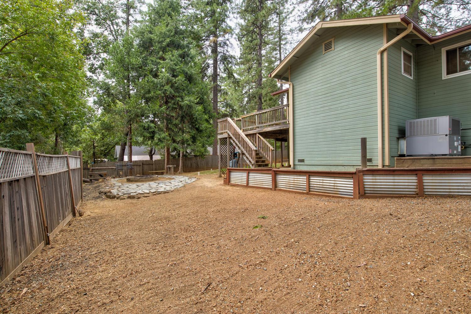 23832 Old Madrone Road Pioneer, CA 95666 - Photo 30 of 48 a view of backyard with wooden fence and a large tree