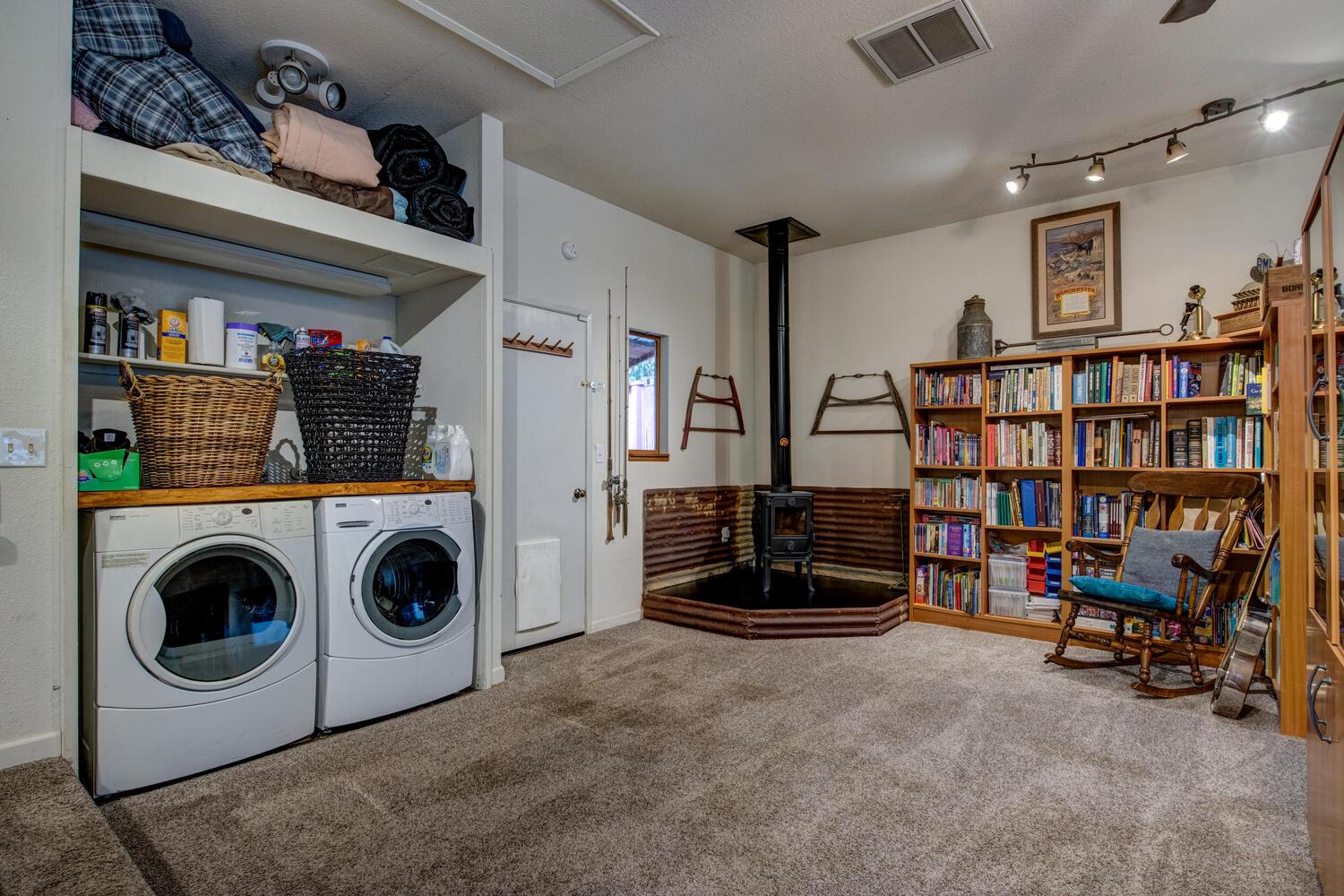 23832 Old Madrone Road Pioneer, CA 95666 - Photo 7 of 48 a view of a livingroom with furniture and washer dryer