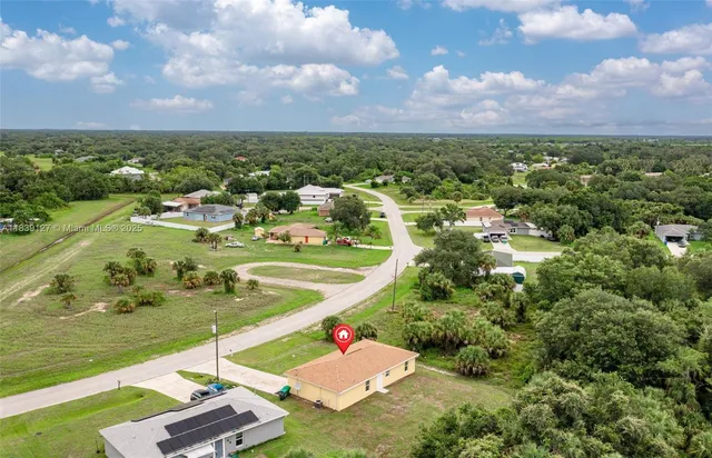 an aerial view of a house with a garden