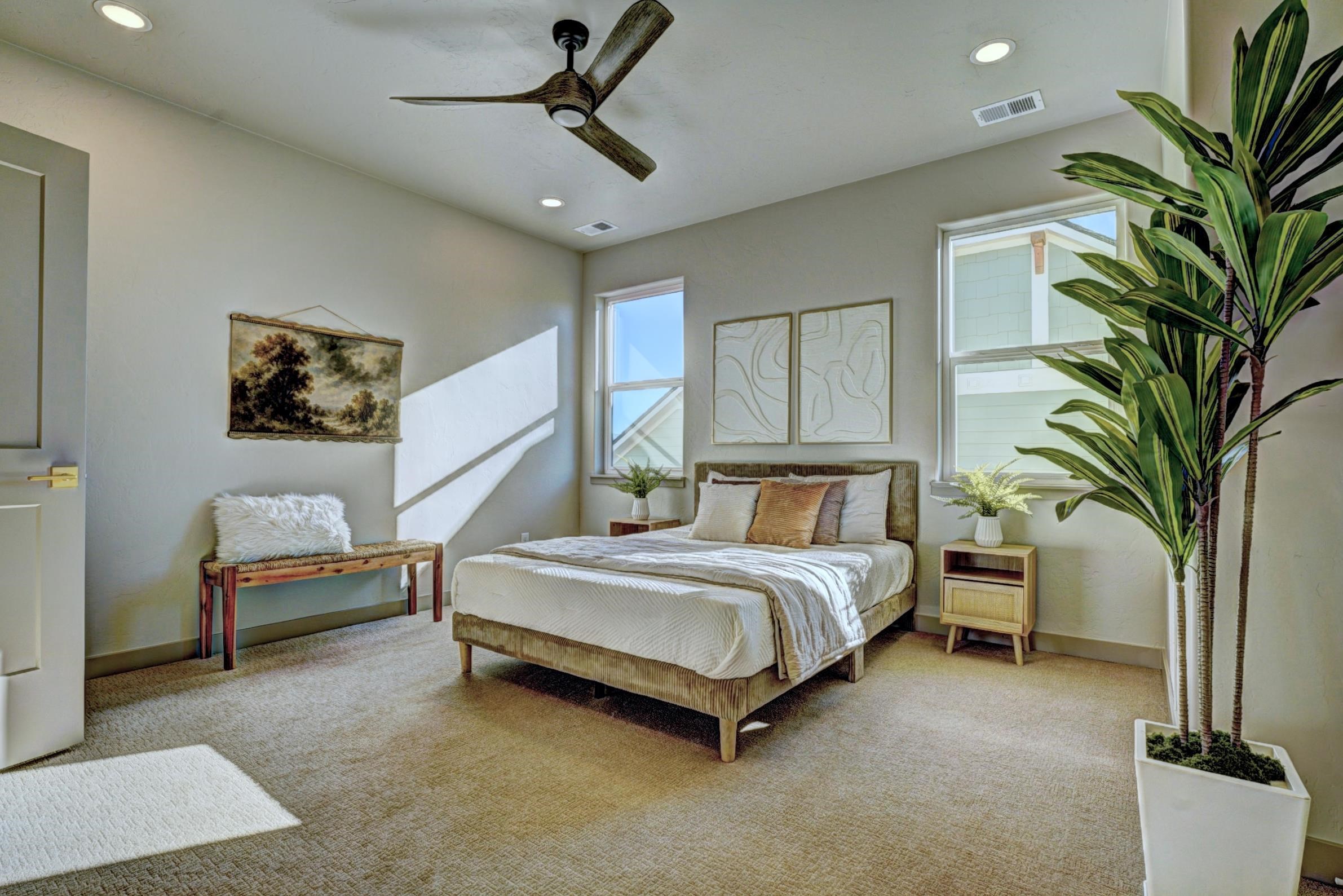 1985 Tomochic Drive Fruita, CO 81521 - Photo 31 of 41 a spacious bedroom with a bed and a potted plant